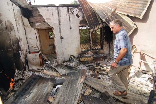 Fr Dan surveys the destruction of the Priest's House
