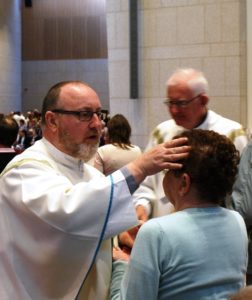 Fr John Denvir SMA administers the Sacrament of the Sick
