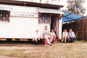 Fr Fionbarra and Fr Ed Hubert SMA with visitors to their 'home' in the refugee camp on the Rwanda border