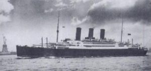 SS California in 1923, sailing past the Statue of Liberty. Note the two dummy funnels, removed circa 1939 when requisitioned by the Admiralty.